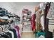 Organized walk-in closet with ample storage space, shelves, and hanging rods for efficient clothing management at 4125 Fallbrook Dr, Duluth, GA 30096