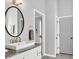 Bathroom vanity featuring granite countertops, a large mirror, and neutral colors at 5625 Brookstone Nw Dr, Acworth, GA 30101