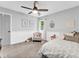 Bedroom with neutral decor, plush carpet, and a chair near the window at 5625 Brookstone Nw Dr, Acworth, GA 30101
