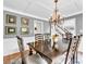 Dining room with chandelier and wainscotting at 5625 Brookstone Nw Dr, Acworth, GA 30101