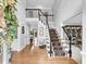 Bright foyer with hardwood floors, staircase and high ceilings, creating an open, welcoming space at 5625 Brookstone Nw Dr, Acworth, GA 30101