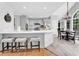 Open-concept kitchen featuring a breakfast bar with seating and view to eat-in area at 5625 Brookstone Nw Dr, Acworth, GA 30101