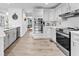 Modern kitchen featuring white cabinets, stainless steel appliances, and ample counter space at 5625 Brookstone Nw Dr, Acworth, GA 30101