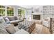 Cozy living room with fireplace, built-in shelving, and comfortable seating at 5625 Brookstone Nw Dr, Acworth, GA 30101