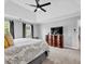 Comfortable main bedroom with plush carpet, tv, and abundant natural light at 5625 Brookstone Nw Dr, Acworth, GA 30101
