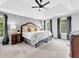 Serene main bedroom with tray ceiling, paneling, and ample natural light at 5625 Brookstone Nw Dr, Acworth, GA 30101