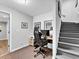 Office featuring a gaming chair, computer, storage, and gray stairs at 5625 Brookstone Nw Dr, Acworth, GA 30101
