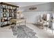 Stylish home office featuring a decorative rug, shelving, and ample natural light, perfect for remote work at 5625 Brookstone Nw Dr, Acworth, GA 30101