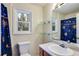 Bathroom featuring a blue star-themed shower curtain, toilet, and vanity at 118 Hunters Pl, Villa Rica, GA 30180