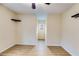 Bright bedroom with neutral walls, wood-look floors, and shelving at 118 Hunters Pl, Villa Rica, GA 30180
