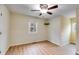 Bright bedroom features wood-look floors, neutral walls and a ceiling fan with light at 118 Hunters Pl, Villa Rica, GA 30180