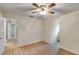 Bedroom featuring wood-look floors, neutral walls, and a ceiling fan with light at 118 Hunters Pl, Villa Rica, GA 30180