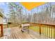 Inviting backyard deck with a grill, perfect for outdoor barbecues and enjoying the scenery at 118 Hunters Pl, Villa Rica, GA 30180