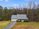 Charming home with mature landscaping, a covered porch, and extended driveway at 118 Hunters Pl, Villa Rica, GA 30180