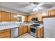 Bright kitchen with wood cabinets, stainless steel appliances, and a light, airy feel at 118 Hunters Pl, Villa Rica, GA 30180