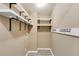 Functional laundry room with ample shelving and hooks for organized storage at 118 Hunters Pl, Villa Rica, GA 30180