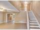 Bright entryway featuring stairs to the second floor and an open doorway at 118 Hunters Pl, Villa Rica, GA 30180