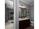 Secondary bathroom with modern vanity, generous counter space, and convenient access to the adjacent playroom at 1205 Renaissance Se Ct, Mableton, GA 30126