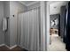 Full bathroom featuring a shower with gray and white patterned curtain and light gray walls at 1205 Renaissance Se Ct, Mableton, GA 30126
