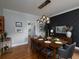 Elegant dining room featuring stylish lighting, a spacious table, and modern decor at 1205 Renaissance Se Ct, Mableton, GA 30126