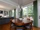 Dining room with pendant lighting, a wood table, and view into the living room at 1205 Renaissance Se Ct, Mableton, GA 30126