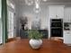 Dining area adjacent to a kitchen with built-in ovens at 1205 Renaissance Se Ct, Mableton, GA 30126