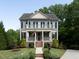 Charming two-story home with a welcoming front porch and second-story balcony at 1205 Renaissance Se Ct, Mableton, GA 30126