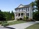 Beautiful two-story home with inviting front porch and manicured lawn at 1205 Renaissance Se Ct, Mableton, GA 30126