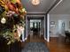 Inviting foyer with hardwood floors and elegant decor leading into the home at 1205 Renaissance Se Ct, Mableton, GA 30126