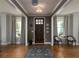 Inviting foyer with hardwood floors and elegant decor leading into the home at 1205 Renaissance Se Ct, Mableton, GA 30126