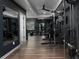 A spacious home gym with modern equipment, dark walls and wood-look flooring at 1205 Renaissance Se Ct, Mableton, GA 30126