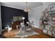 Stylish home office with modern desk, unique wall decor and bright lighting at 1205 Renaissance Se Ct, Mableton, GA 30126