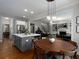 Bright kitchen with an island that flows into a living room with a fireplace at 1205 Renaissance Se Ct, Mableton, GA 30126