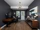 A modern home office features wood floors, stylish lighting, and a sleek desk setup at 1205 Renaissance Se Ct, Mableton, GA 30126