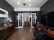 A stylish home office showcases wood floors, French doors, and a trendy light fixture at 1205 Renaissance Se Ct, Mableton, GA 30126