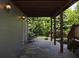 Relaxing outdoor patio features flagstone flooring and a charming view of the backyard's lush greenery at 1205 Renaissance Se Ct, Mableton, GA 30126