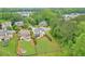 Aerial view of a backyard with a fire pit, mature landscaping, and a wooded area at 134 Johnston Farm Ln, Woodstock, GA 30188