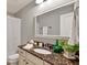 Bathroom features a granite countertop, white cabinets, and decorative accents at 134 Johnston Farm Ln, Woodstock, GA 30188