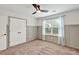 This bedroom offers neutral colors and a ceiling fan for a relaxing, comfortable space at 134 Johnston Farm Ln, Woodstock, GA 30188
