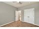 Comfortable bedroom with neutral walls, a ceiling fan, and a closet at 134 Johnston Farm Ln, Woodstock, GA 30188