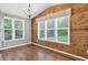 Bright dining area features wood-paneled walls and large windows with natural light at 134 Johnston Farm Ln, Woodstock, GA 30188