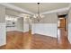 Elegant dining area with hardwood floors and built-in cabinets and shelving at 134 Johnston Farm Ln, Woodstock, GA 30188