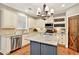Elegant kitchen features granite countertops, stainless steel appliances, and ample storage at 134 Johnston Farm Ln, Woodstock, GA 30188