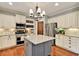 Well-equipped kitchen boasts stainless steel appliances and a stylish center island at 134 Johnston Farm Ln, Woodstock, GA 30188