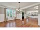 Open living room showcasing hardwood floors, stylish lighting, and built-in shelving at 134 Johnston Farm Ln, Woodstock, GA 30188