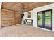 This covered patio features a wood ceiling, privacy screen, and space for entertaining at 134 Johnston Farm Ln, Woodstock, GA 30188