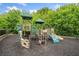 Fun playground area with climbing structures, slides, and soft ground covering for  at 134 Johnston Farm Ln, Woodstock, GA 30188