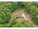 Aerial view of home surrounded by dense trees, nestled in nature at 1825 Epperson Rd, Canton, GA 30115