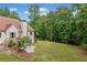 Large, well-maintained backyard surrounded by lush trees, offering privacy and a serene setting, perfect for outdoor activities at 1825 Epperson Rd, Canton, GA 30115