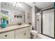 Bathroom with granite vanity, shower with glass door, and neutral decor at 1825 Epperson Rd, Canton, GA 30115